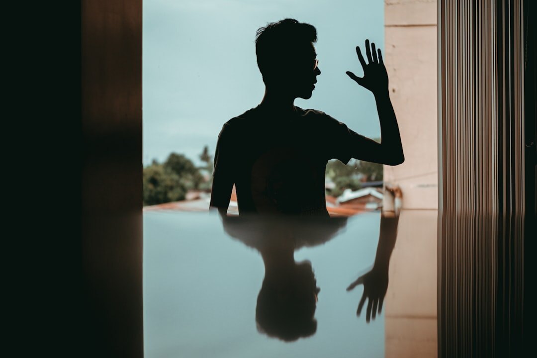 person reflecting in mirror