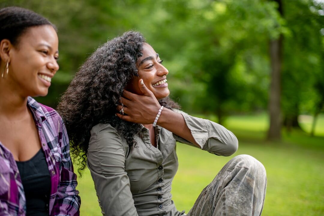 Woman having a warm conversation with a friend outdoors